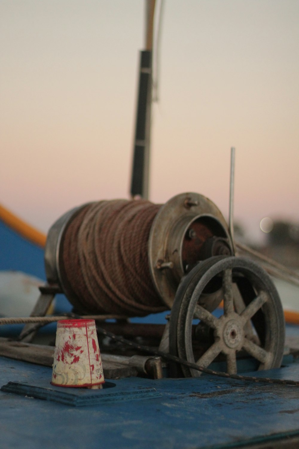 a spool of thread sitting on top of a boat