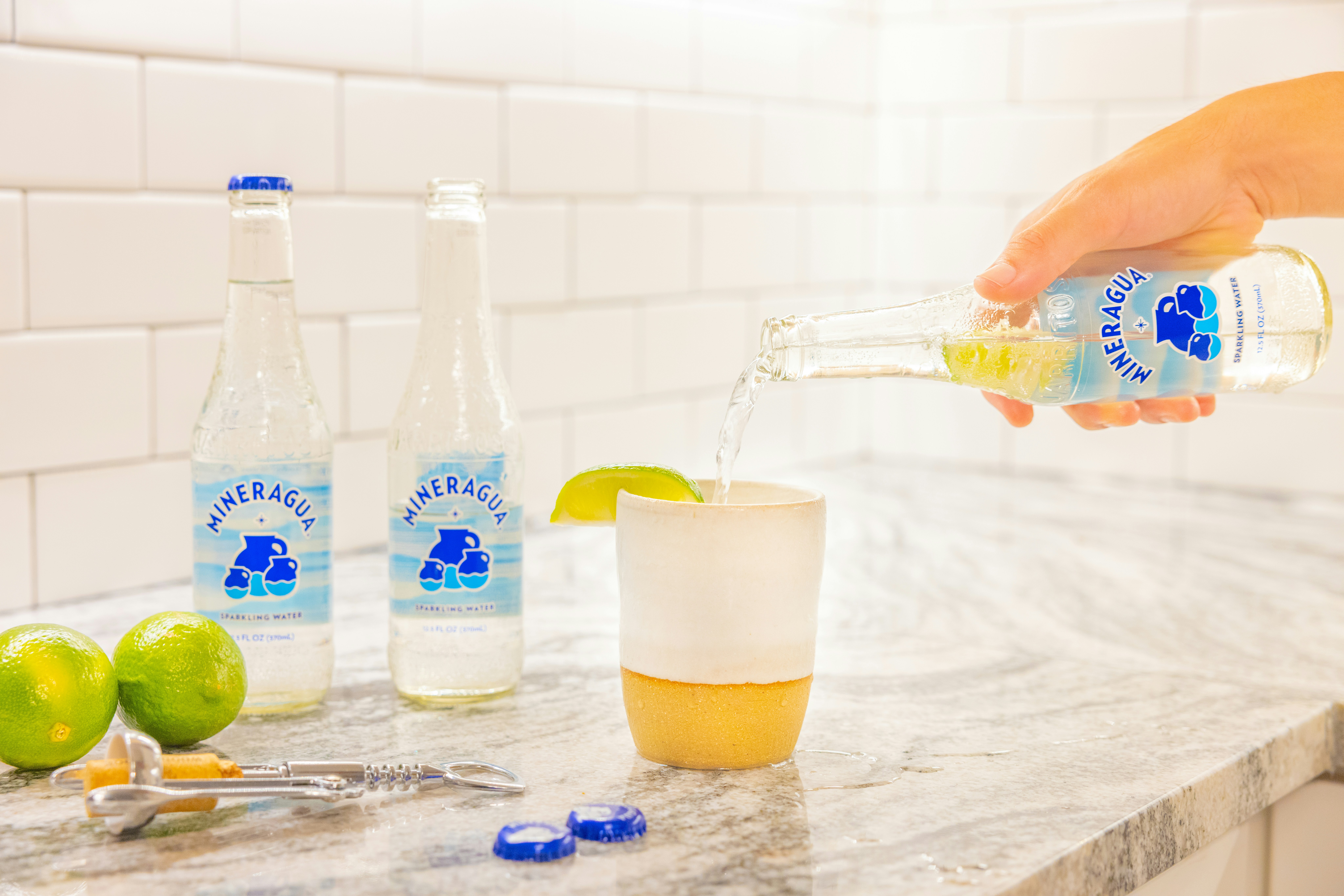 Sparkling citrus beverage being poured into a glass
