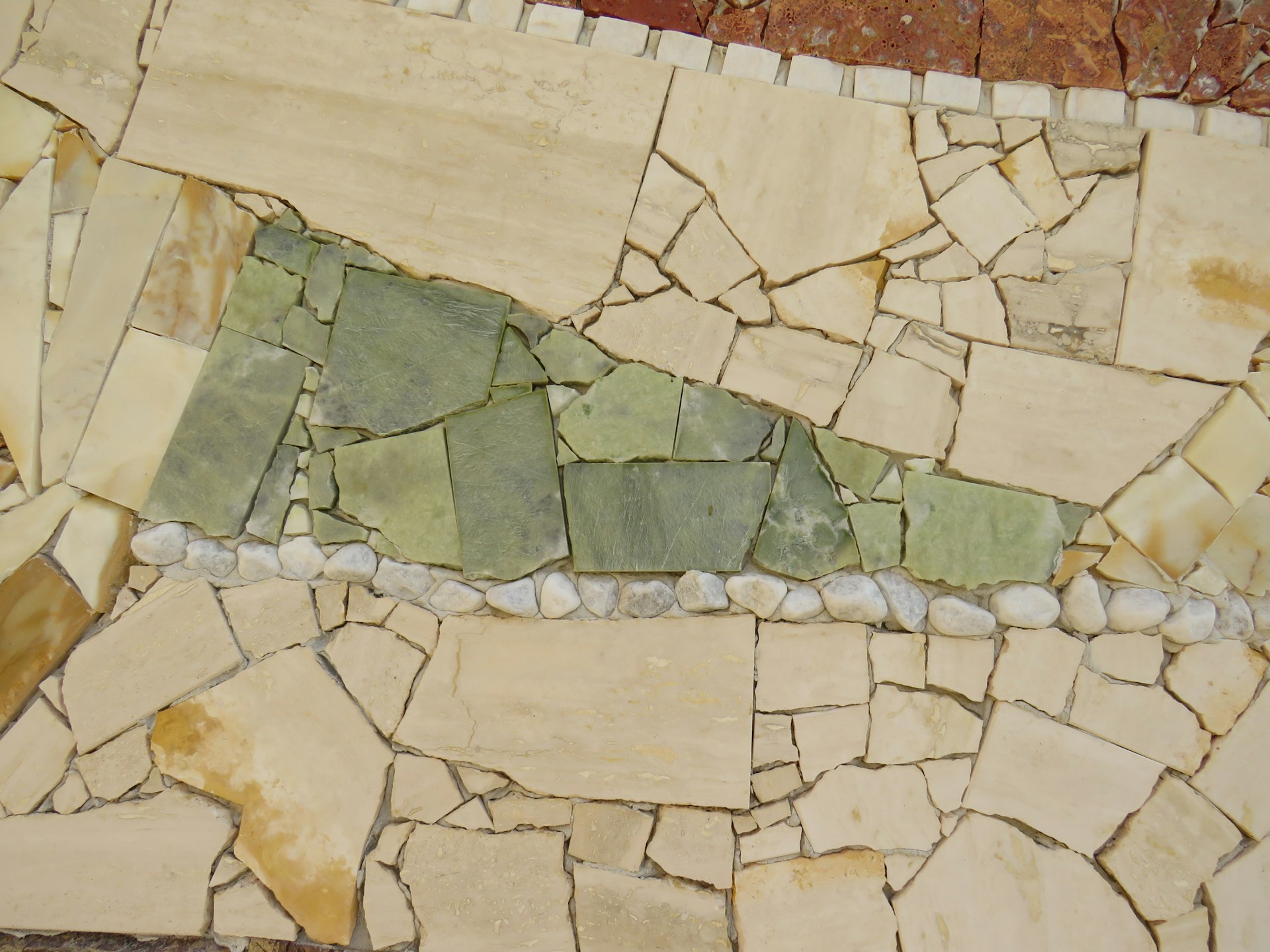 a close up of a wall made of rocks and stones