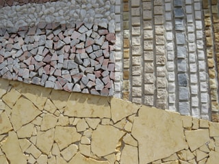 a close up of a wall made out of different types of tiles