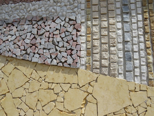 a close up of a wall made out of different types of tiles