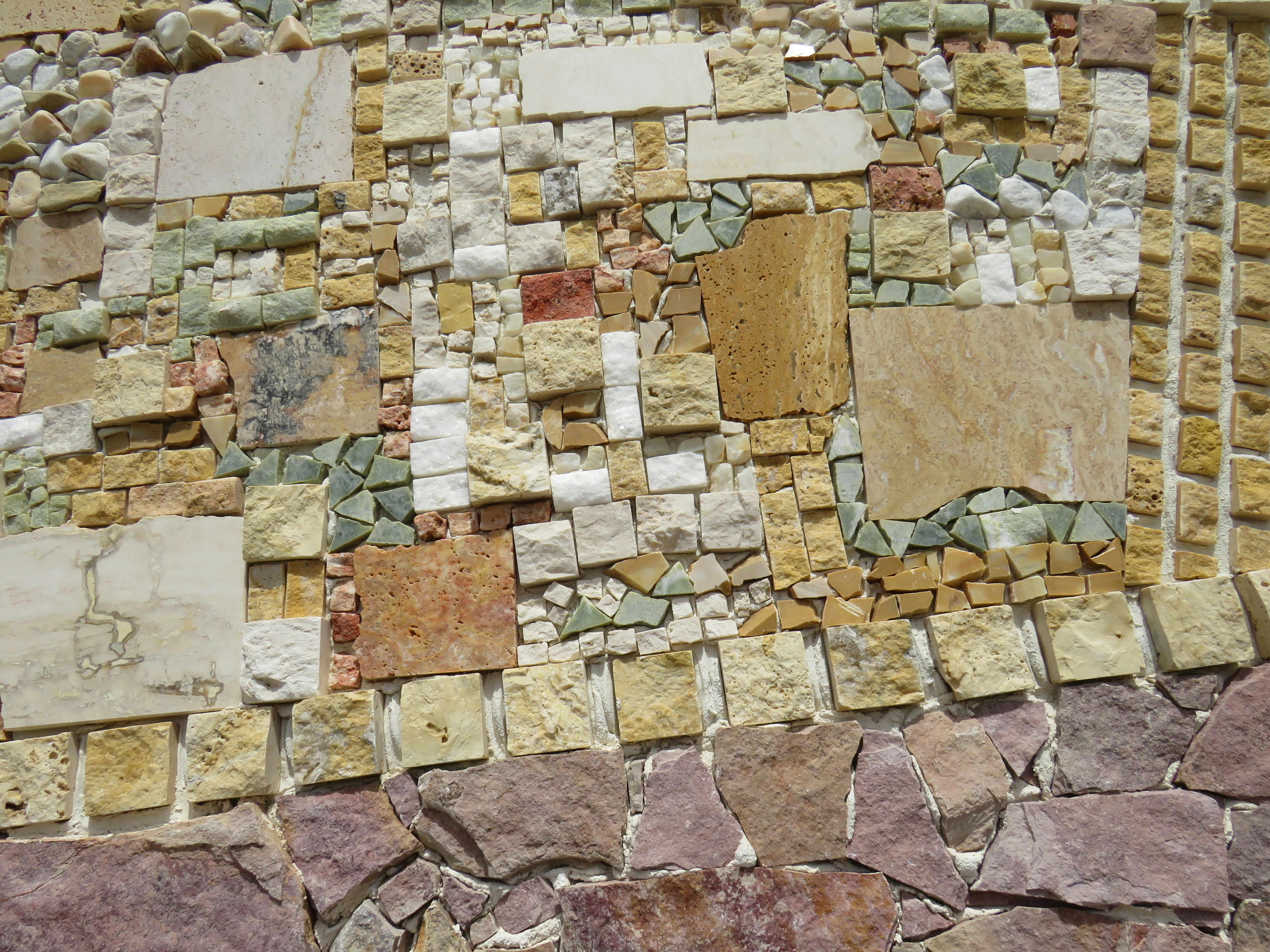 a close up of a wall made of rocks and stones