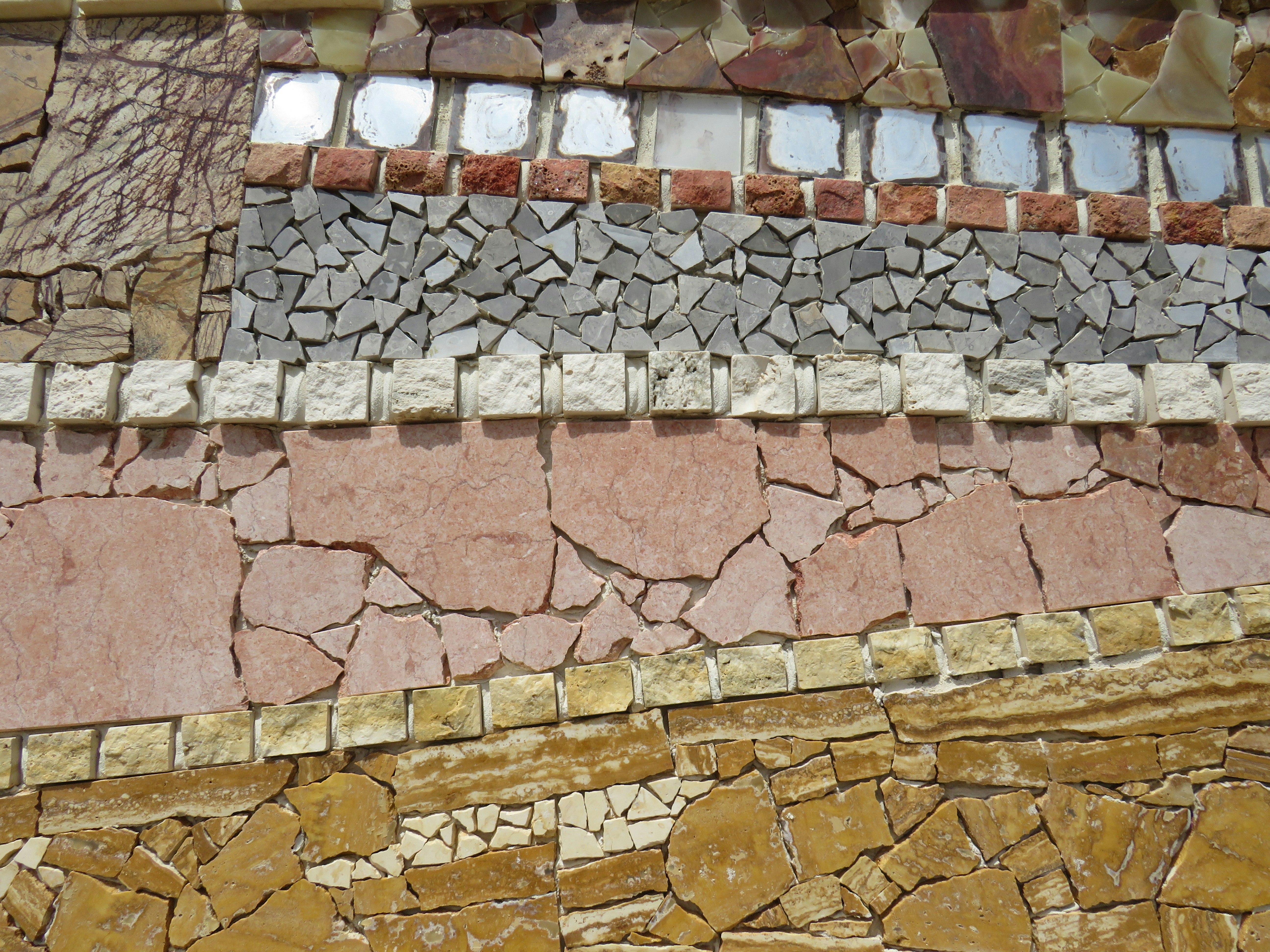 a close up of a wall made of rocks and stones