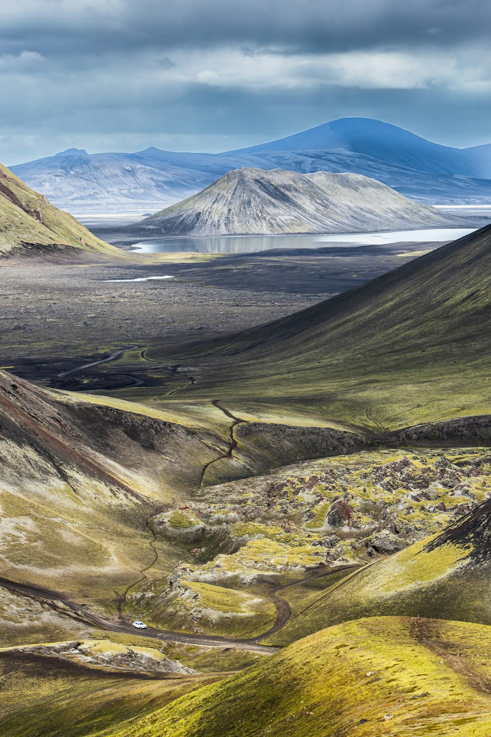 a valley with a mountain in the background