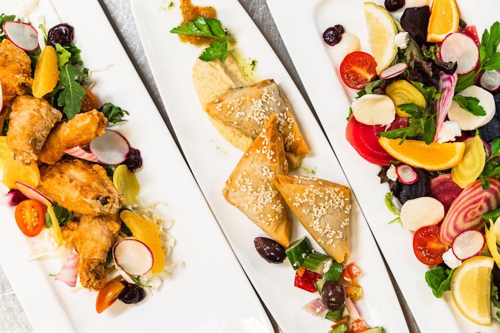 three plates of food with different types of food on them