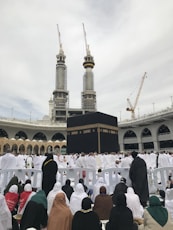 a group of people sitting in front of a large building