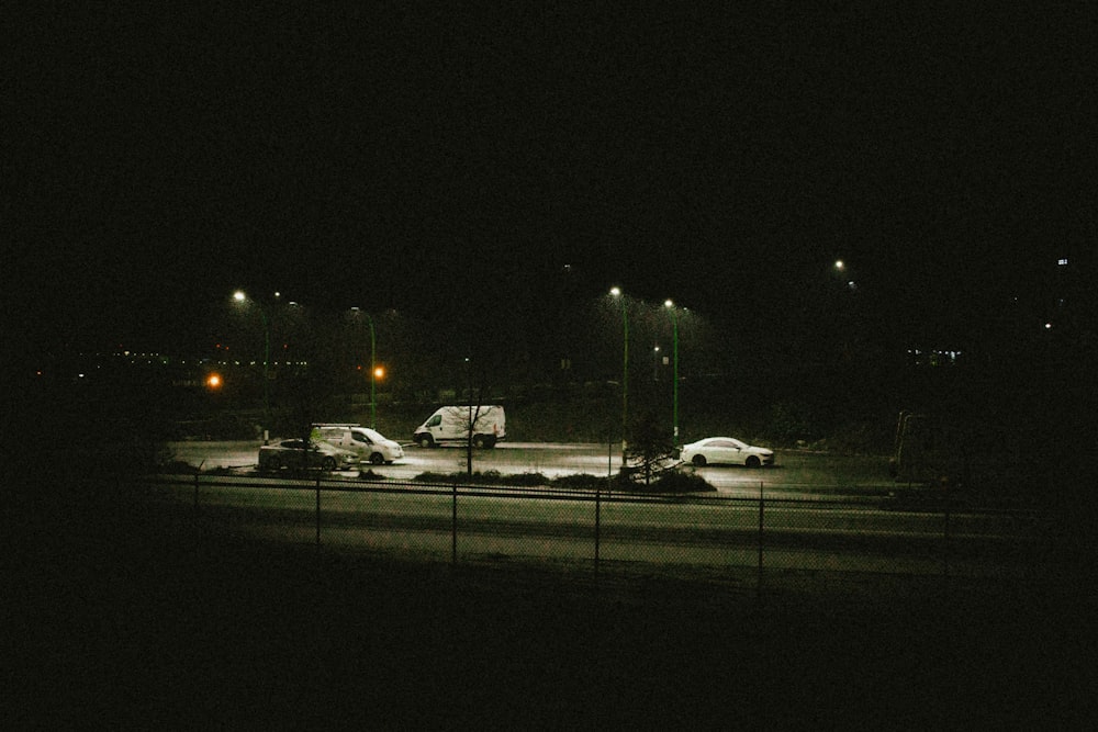 a couple of cars that are sitting in the street