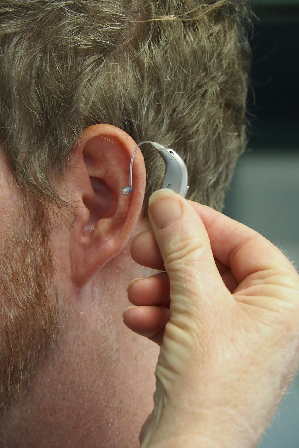 a man wearing a pair of ear piercings