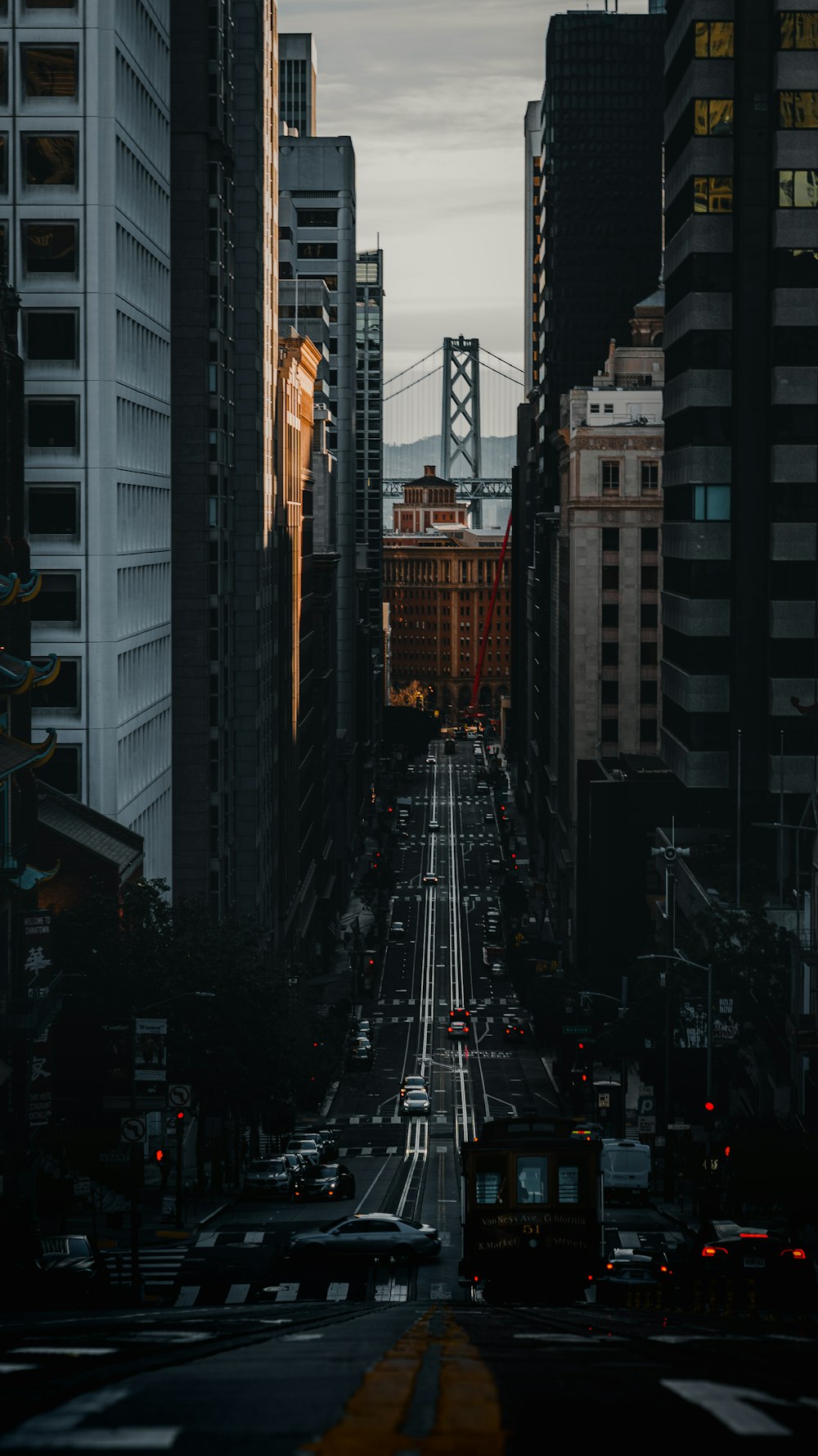 a city street filled with traffic and tall buildings