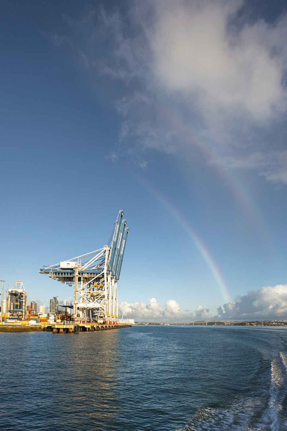 a large crane sitting on top of a body of water