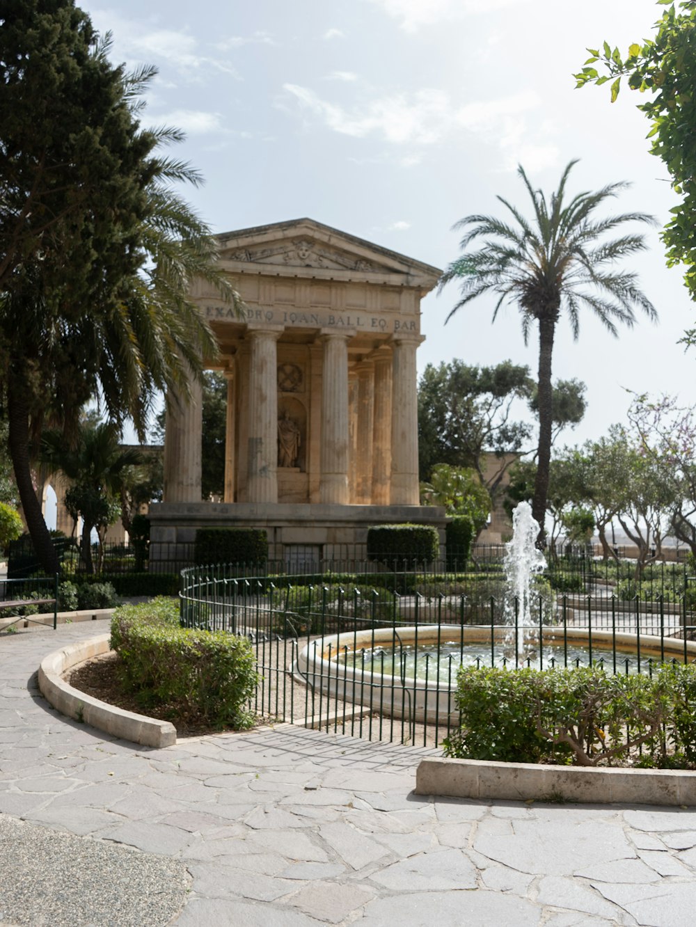 a small fountain in the middle of a park