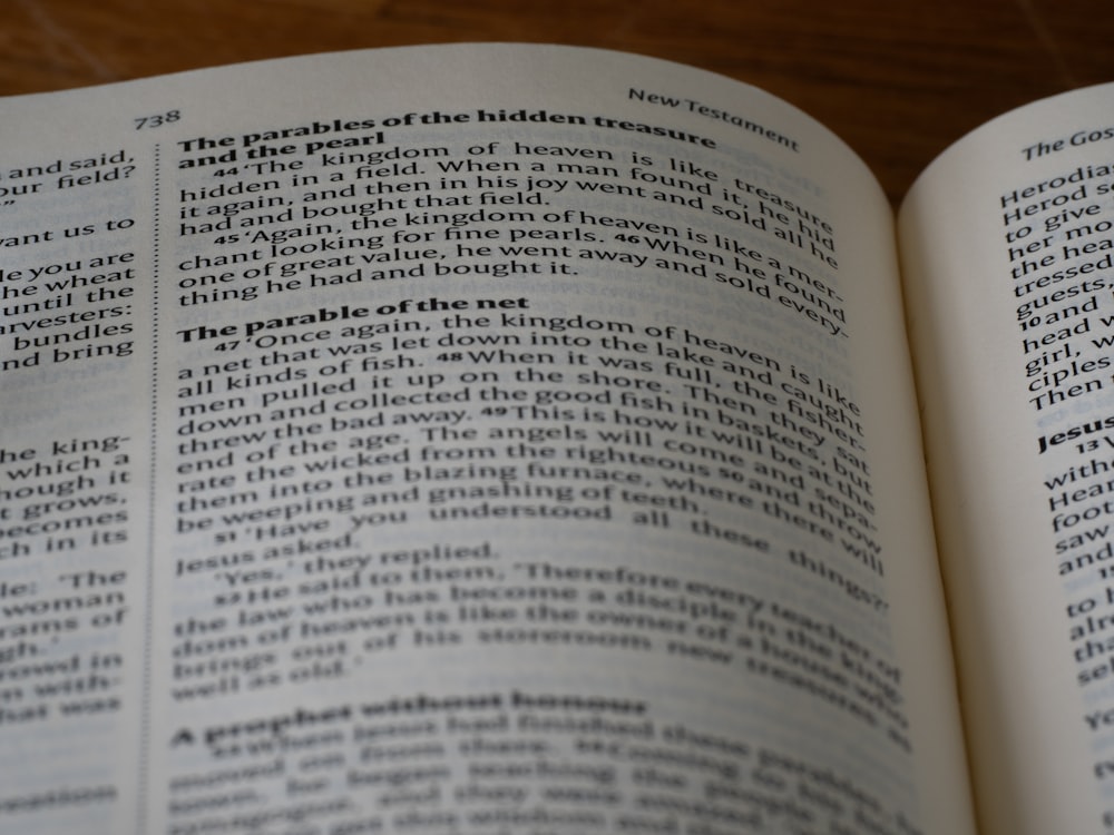 a close up of an open book on a table