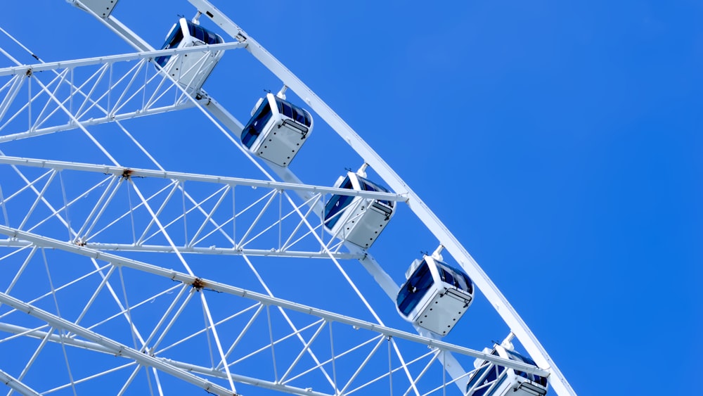 a ferris wheel with blue sky in the background