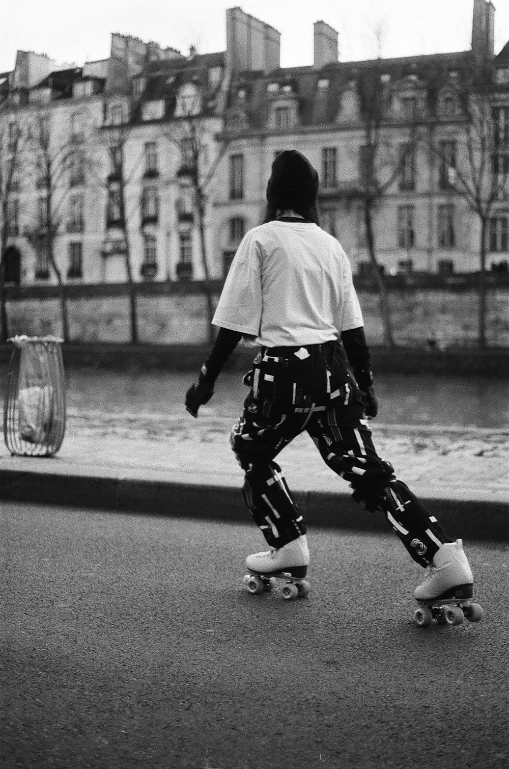 a man riding a skateboard down a street