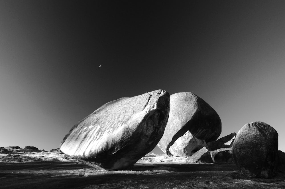 a black and white photo of two large rocks