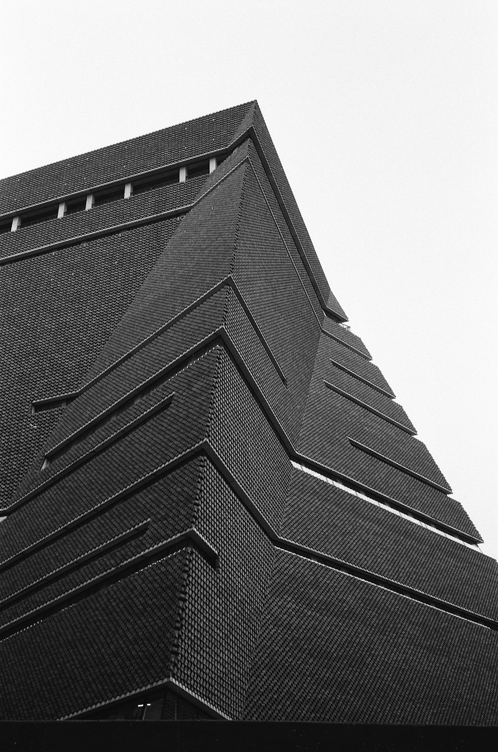 a black and white photo of a tall building