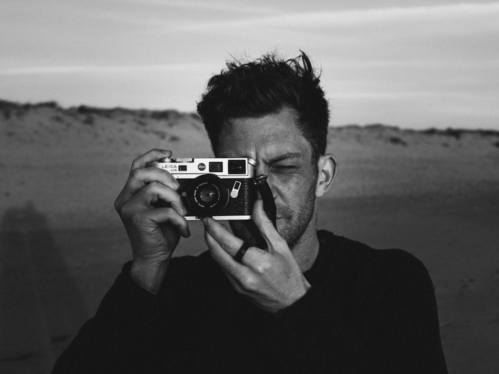 a man taking a picture of himself with a camera