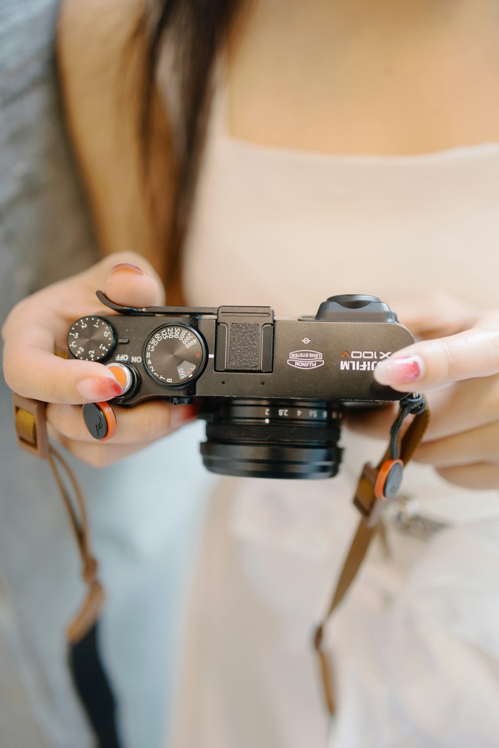 a woman holding a camera in her hands