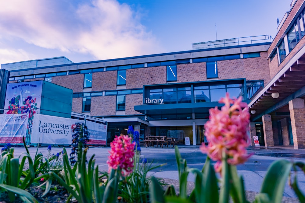 a building with a bunch of flowers in front of it