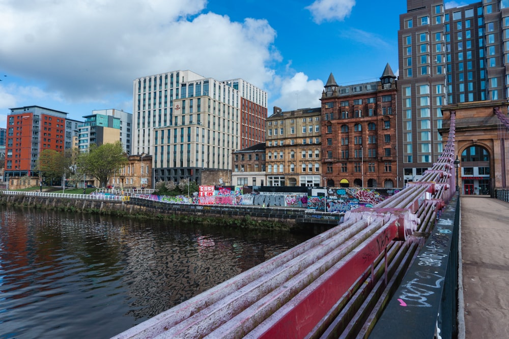 a river runs through a city with tall buildings