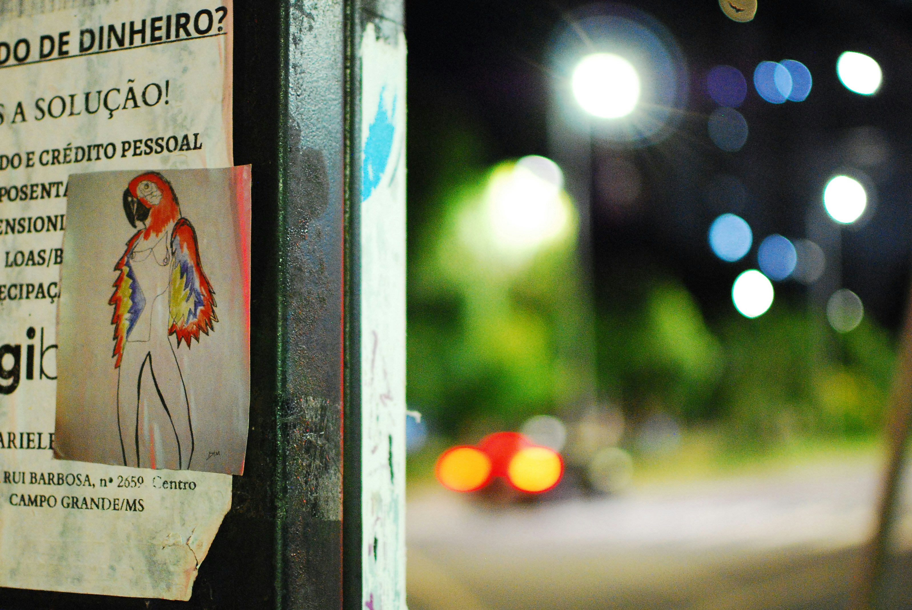 a sign on a pole on the side of the road