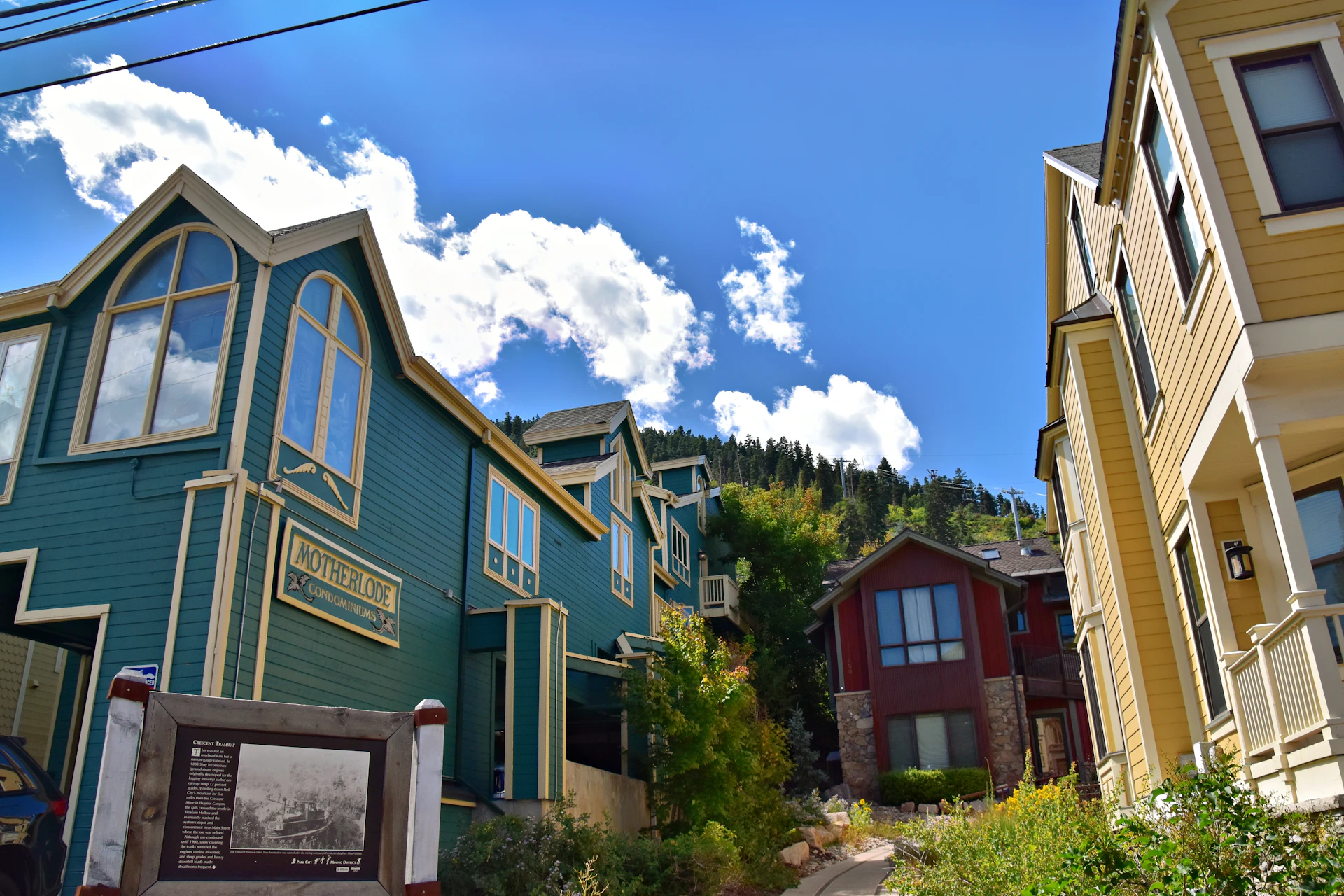 a row of houses with a sign in front of them