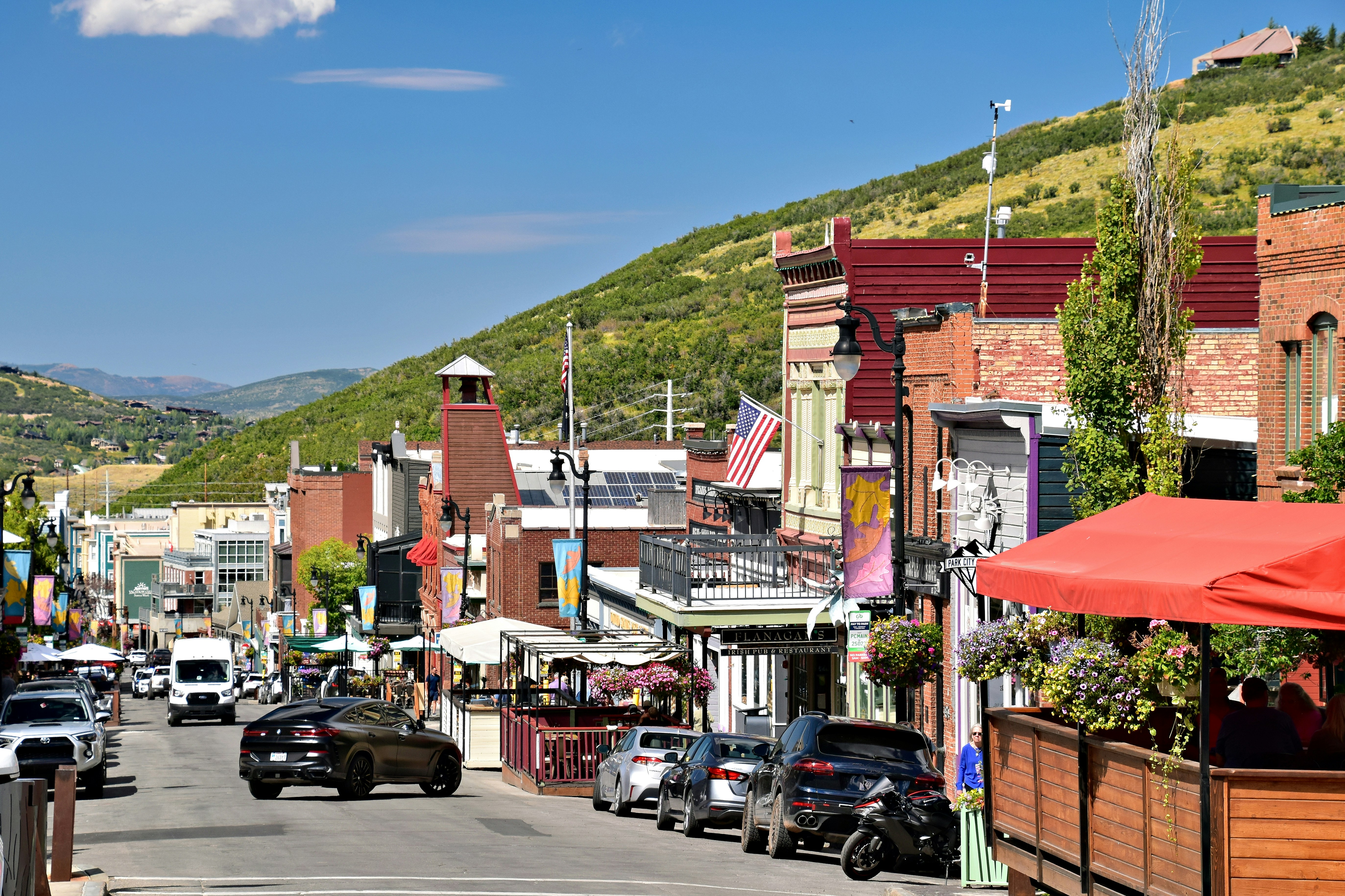 a city street with a mountain in the background