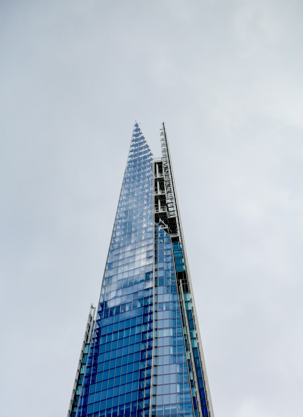 a very tall building with a sky background