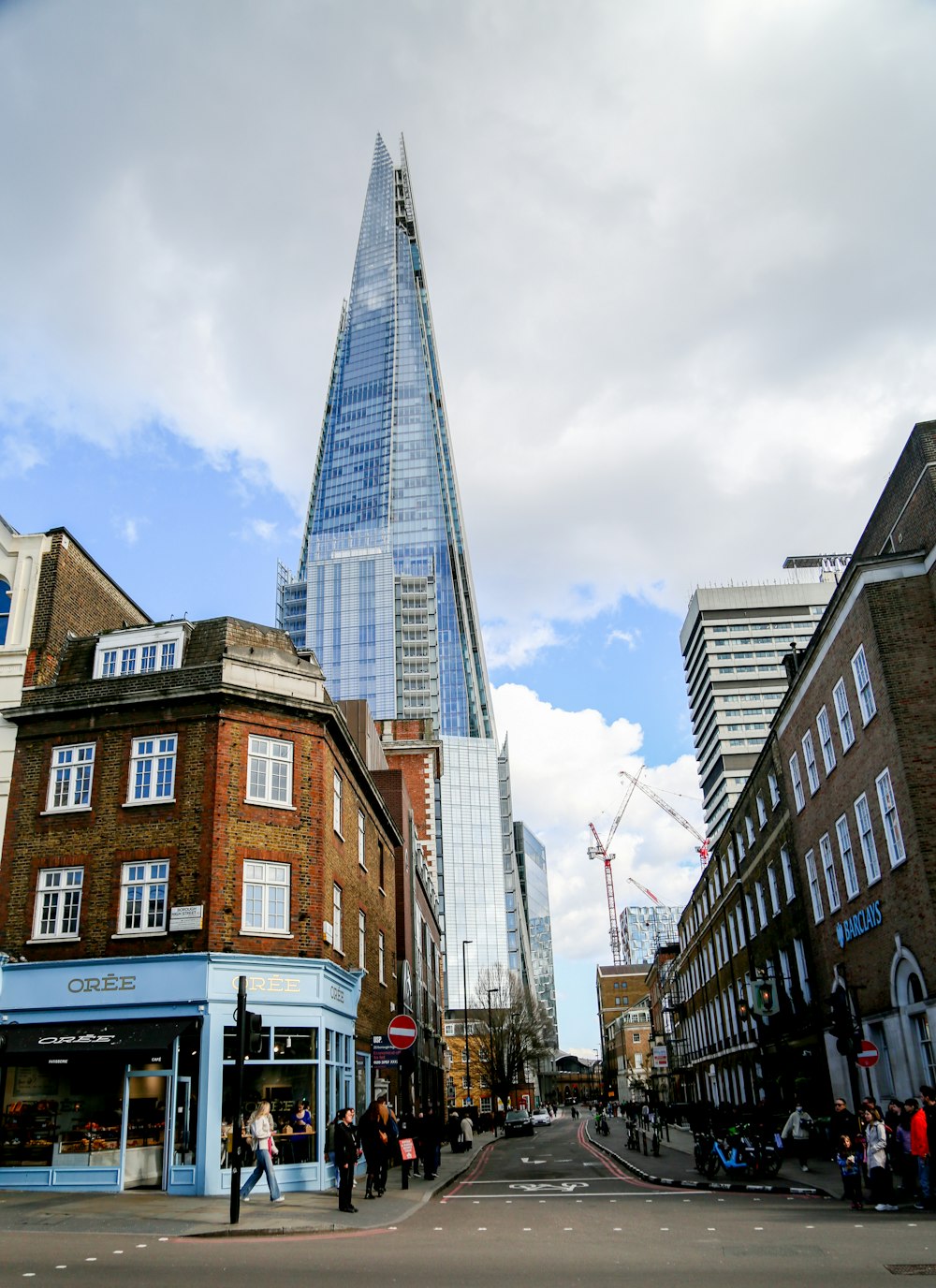 a very tall building towering over a city