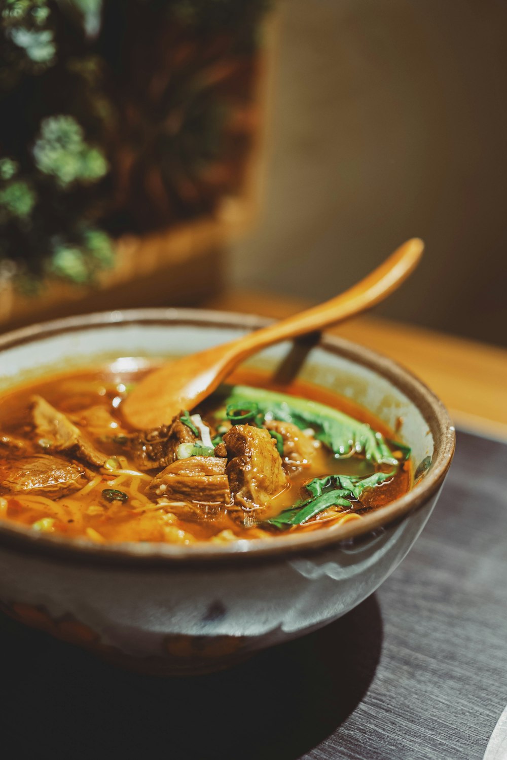 a bowl of soup with a spoon in it