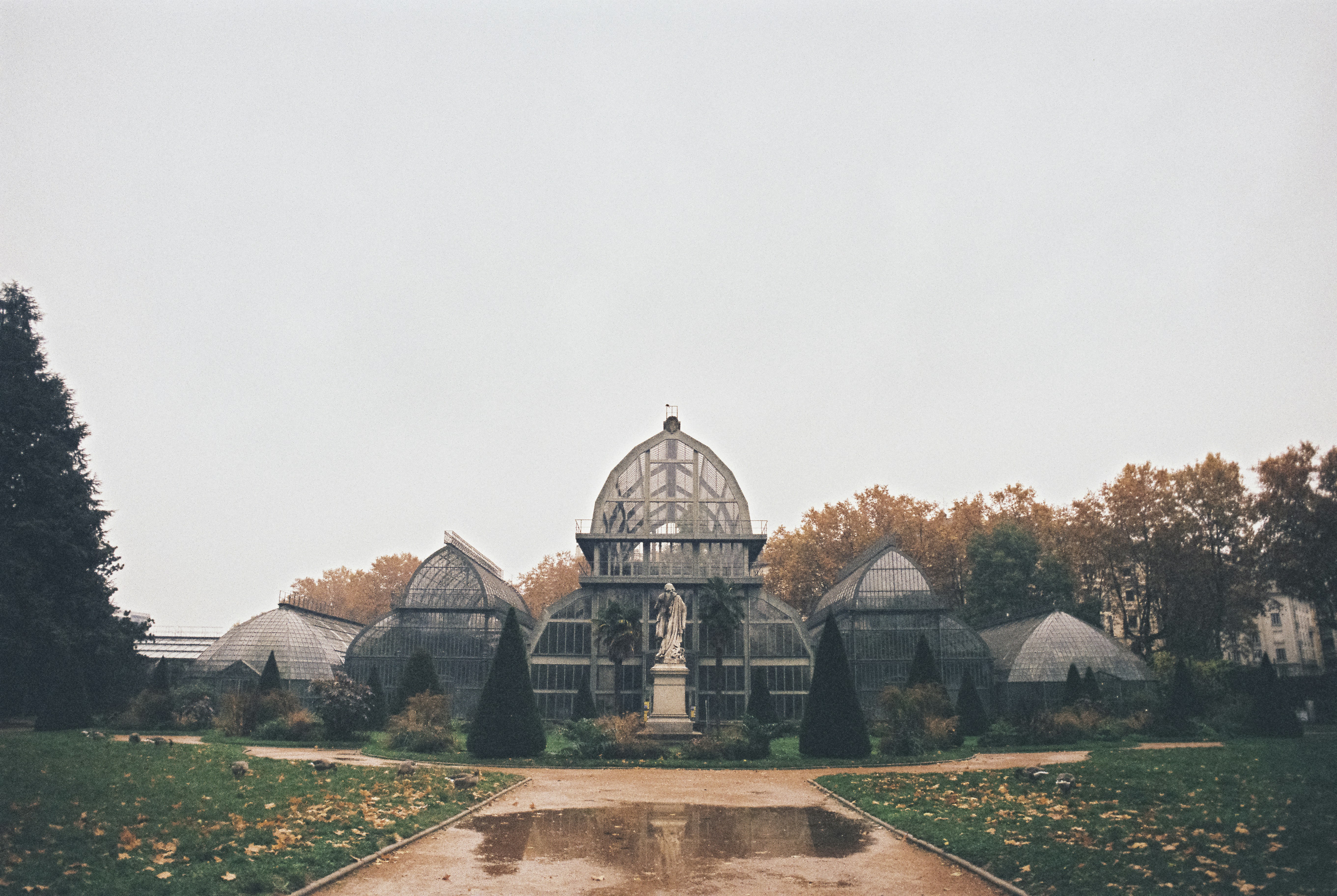 a large building with a fountain in front of it