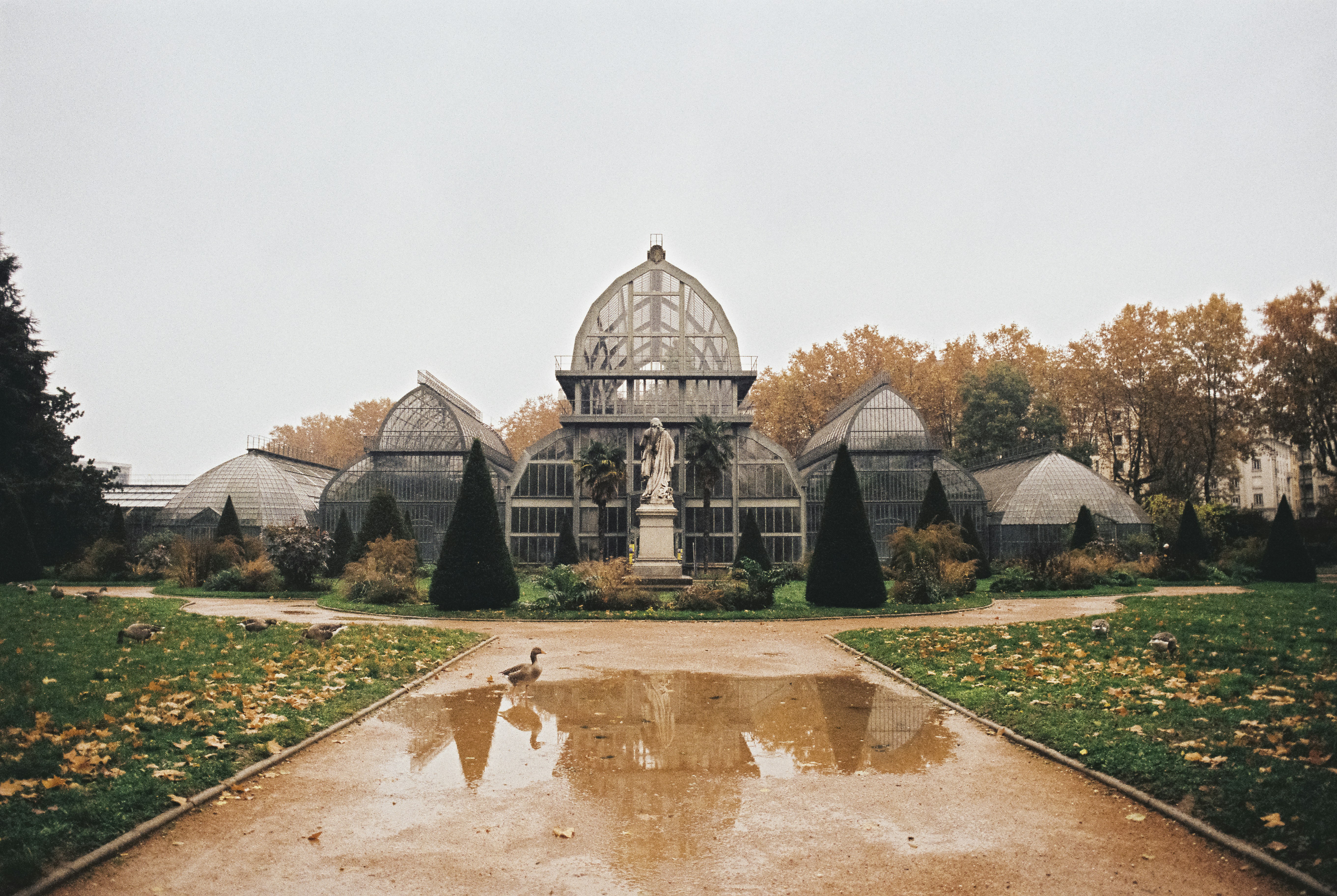 a large building with a fountain in the middle of it