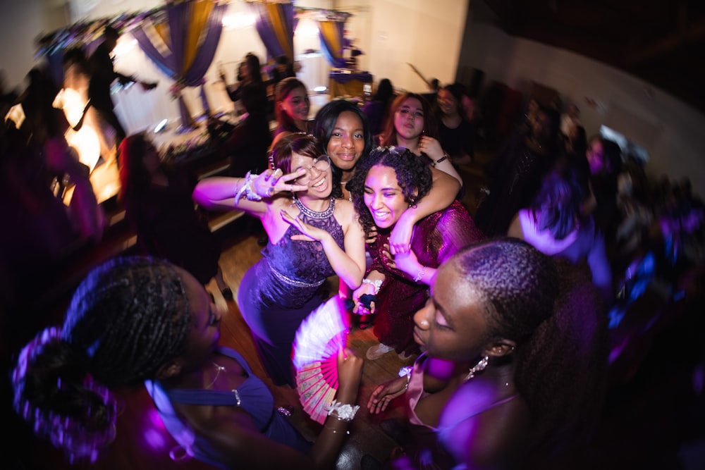 a group of people dancing at a party