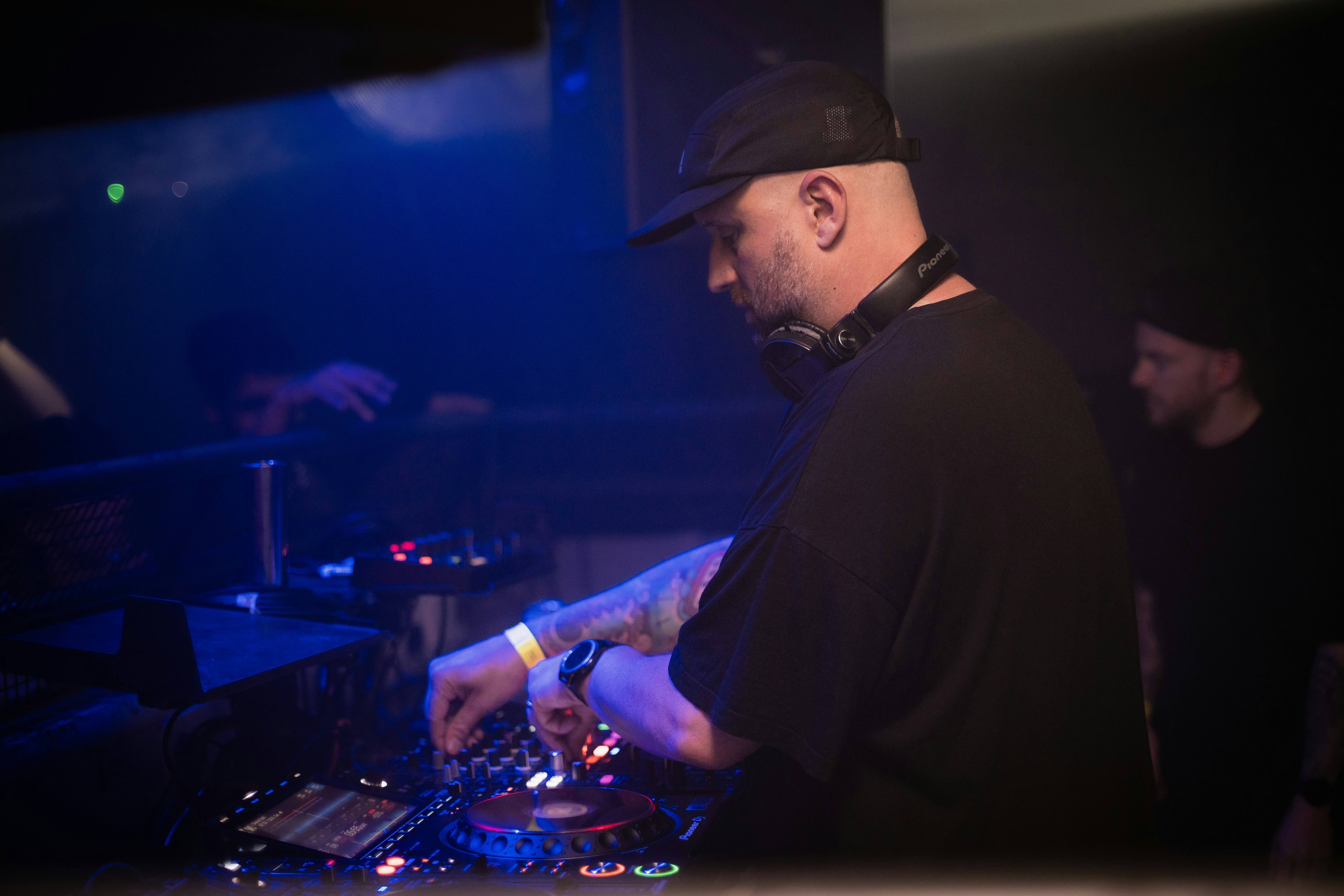 a dj mixing music in a dark room