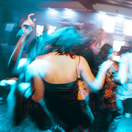 a group of people dancing at a party