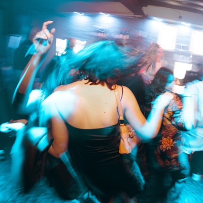 a group of people dancing at a party