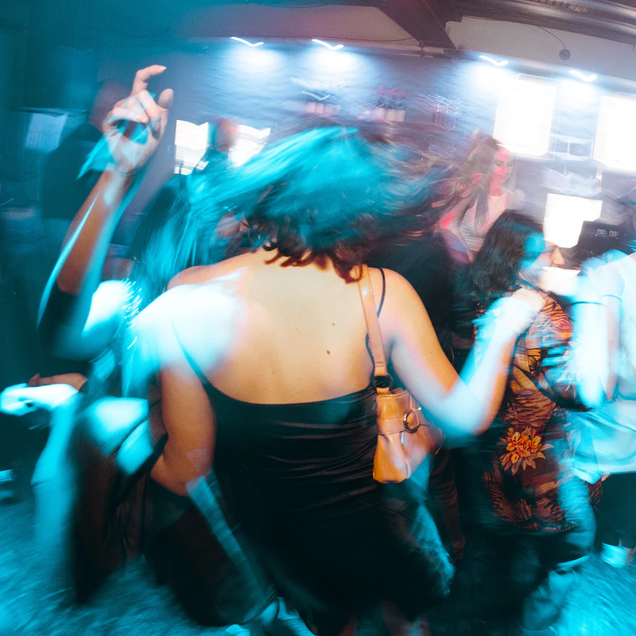 A dancer caught mid-turn in blue light