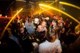 a group of people dancing at a party