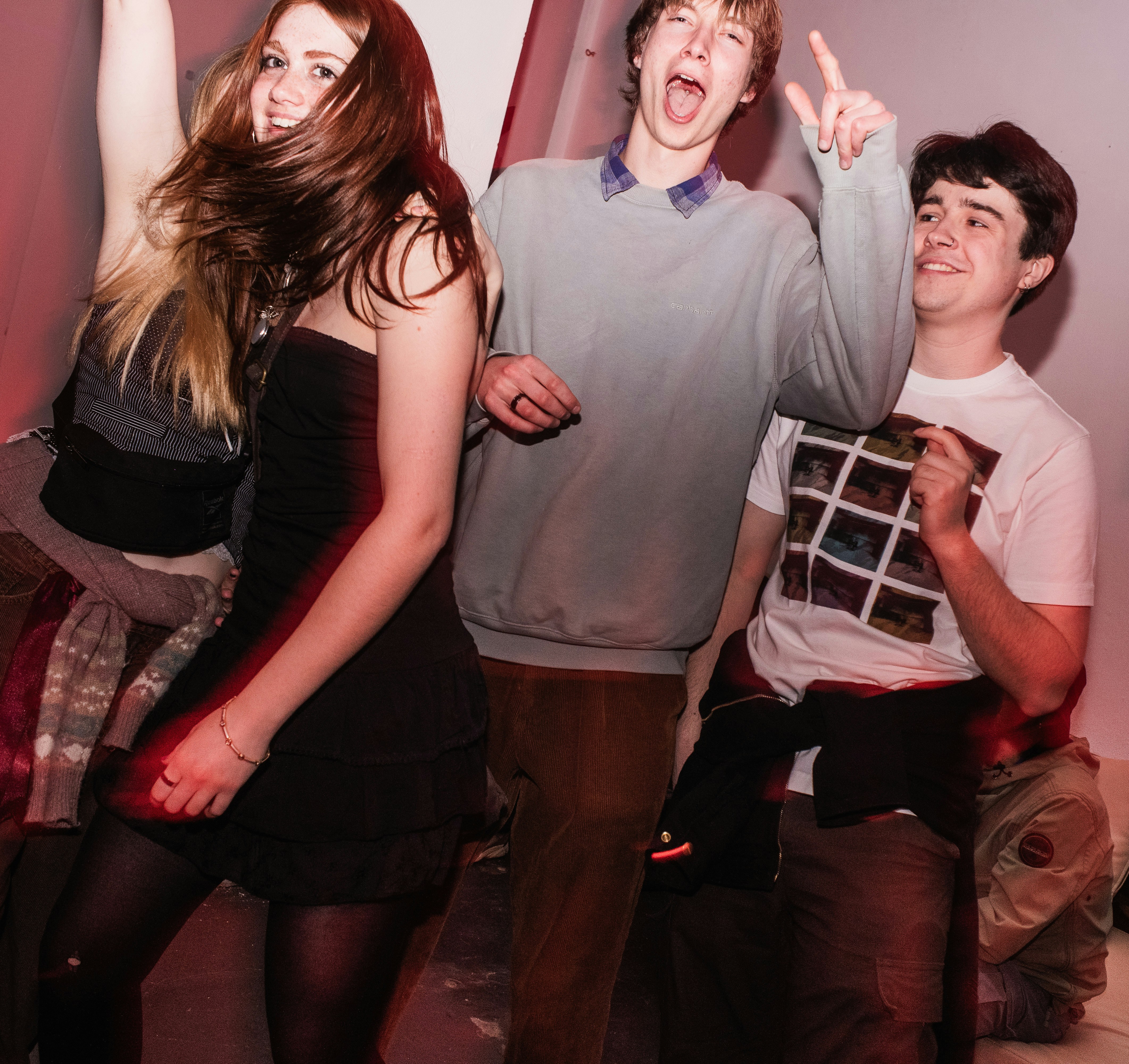 a group of young people standing next to each other