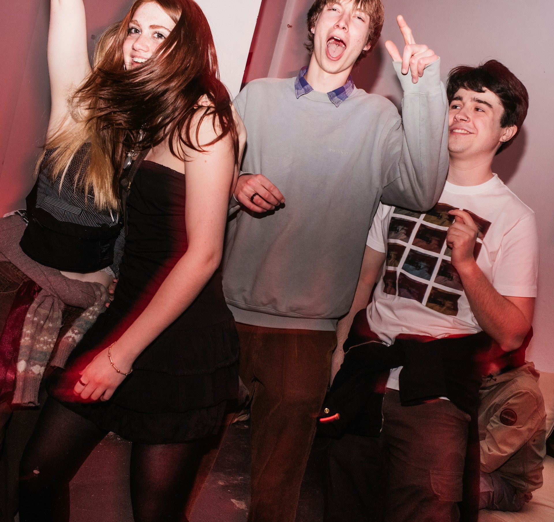 a group of young people standing next to each other