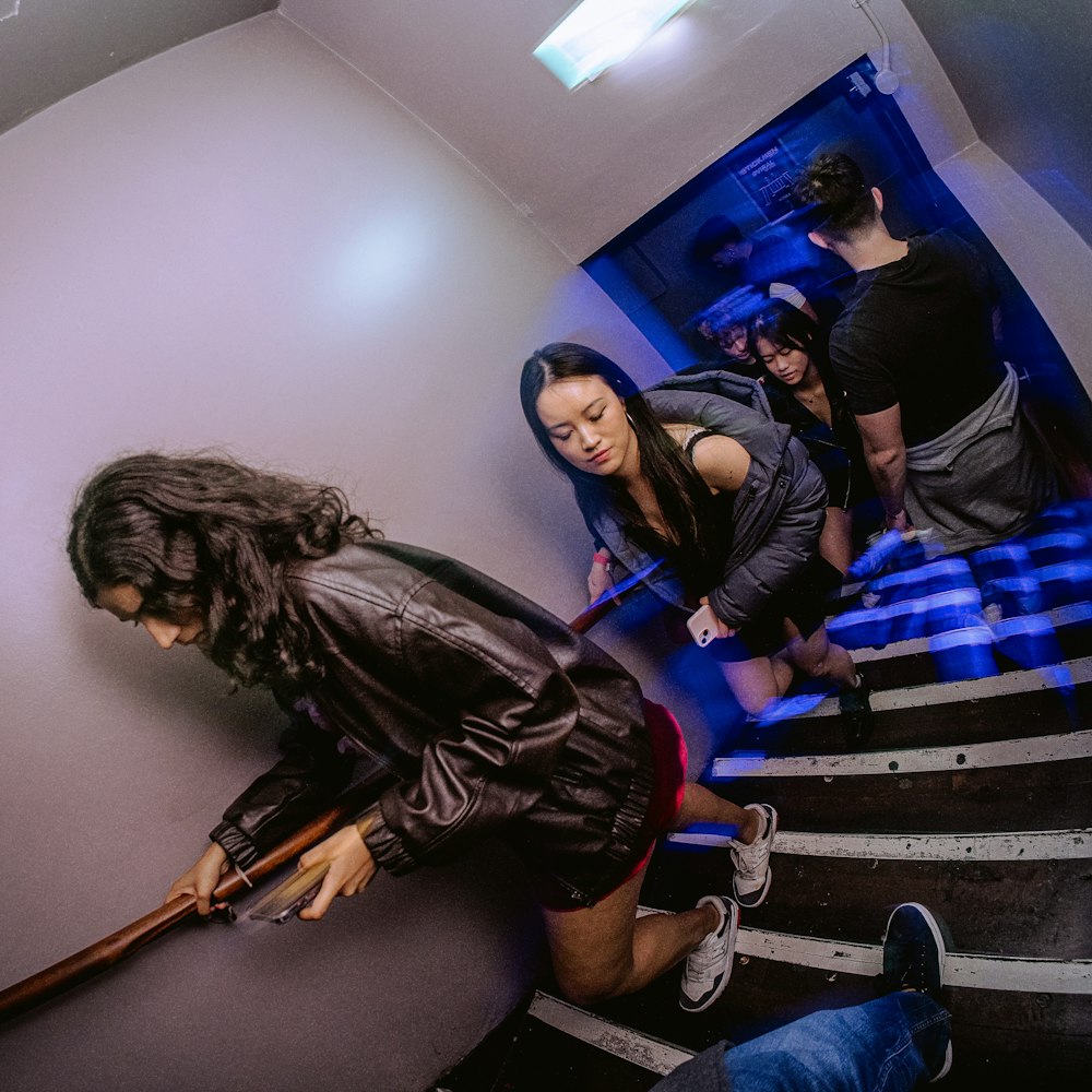 a group of people walking up a flight of stairs