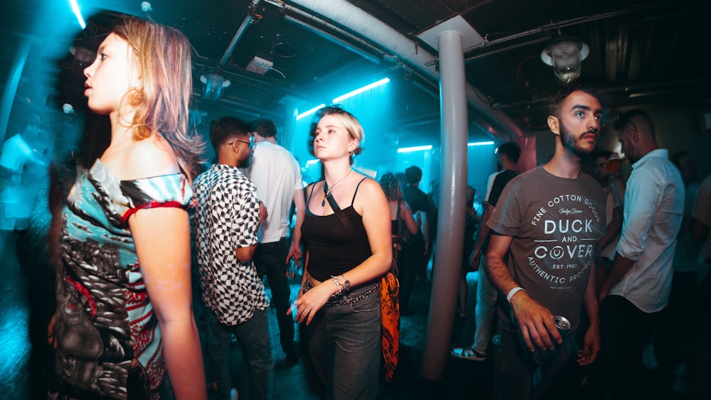 a group of people standing around in a room