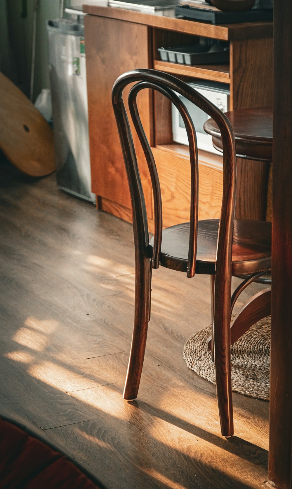 a wooden chair sitting on top of a hard wood floor