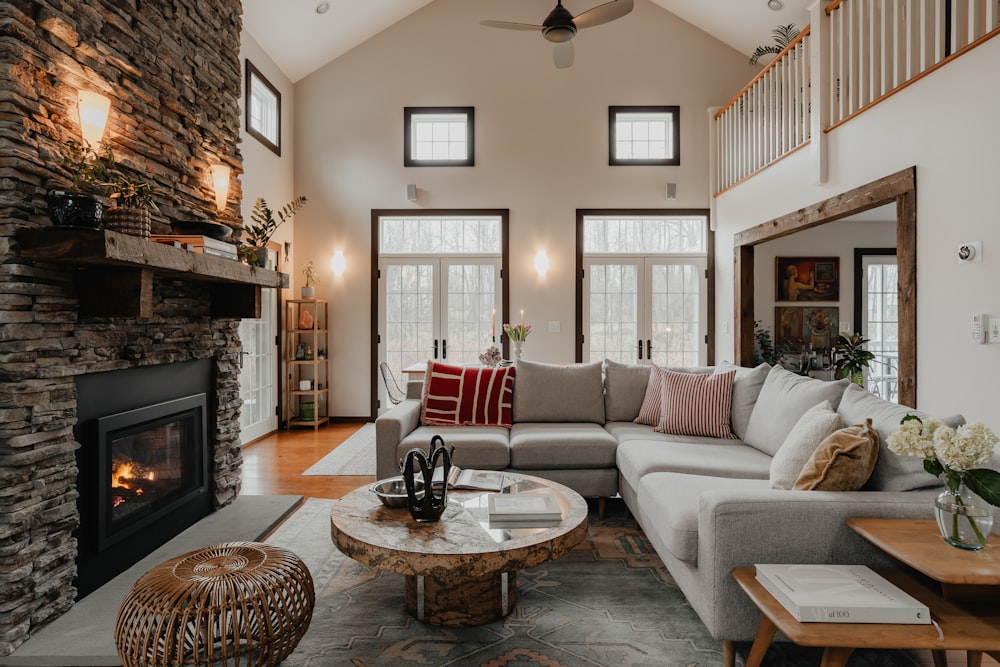 a living room filled with furniture and a fire place