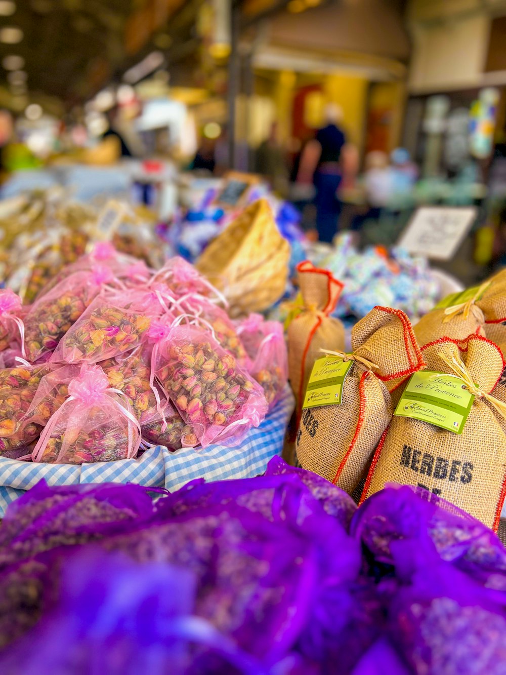 bags of nuts are on display at a market