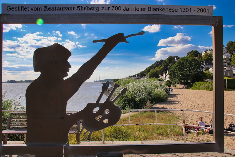 a sculpture of a man holding a guitar