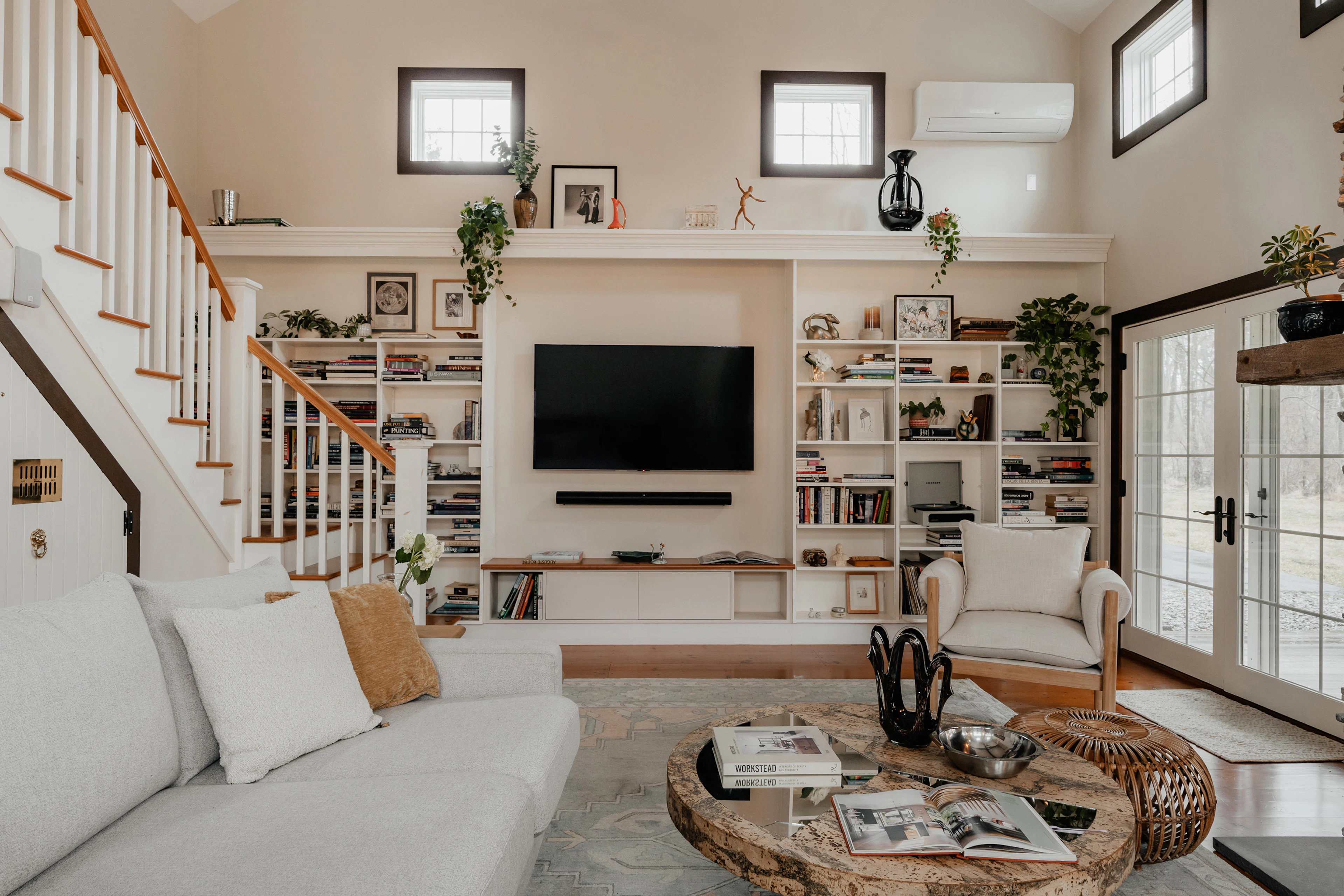 Living room with a custom built-in entertainment wall and shelving