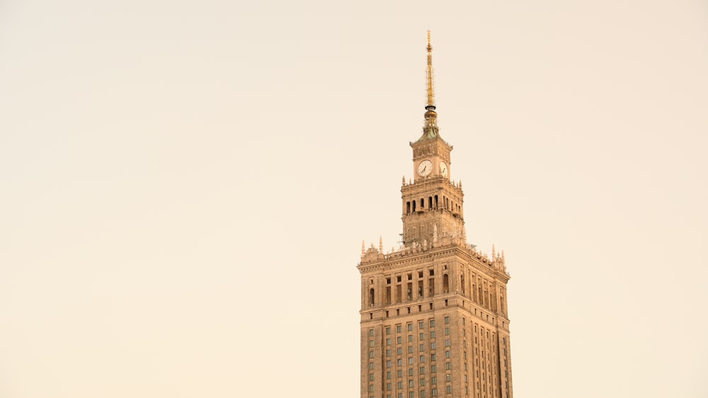 a tall building with a clock on the top of it