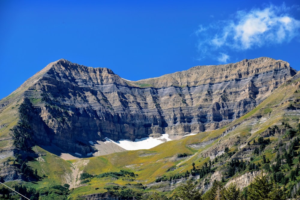 a mountain with a snow capped peak in the distance