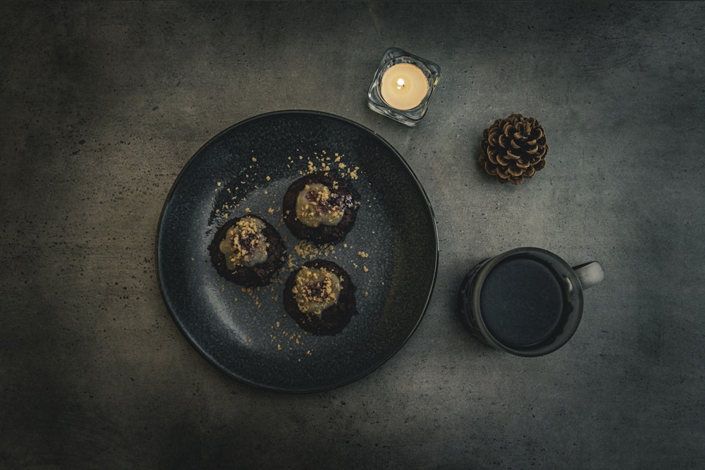 a plate of food next to a cup of coffee